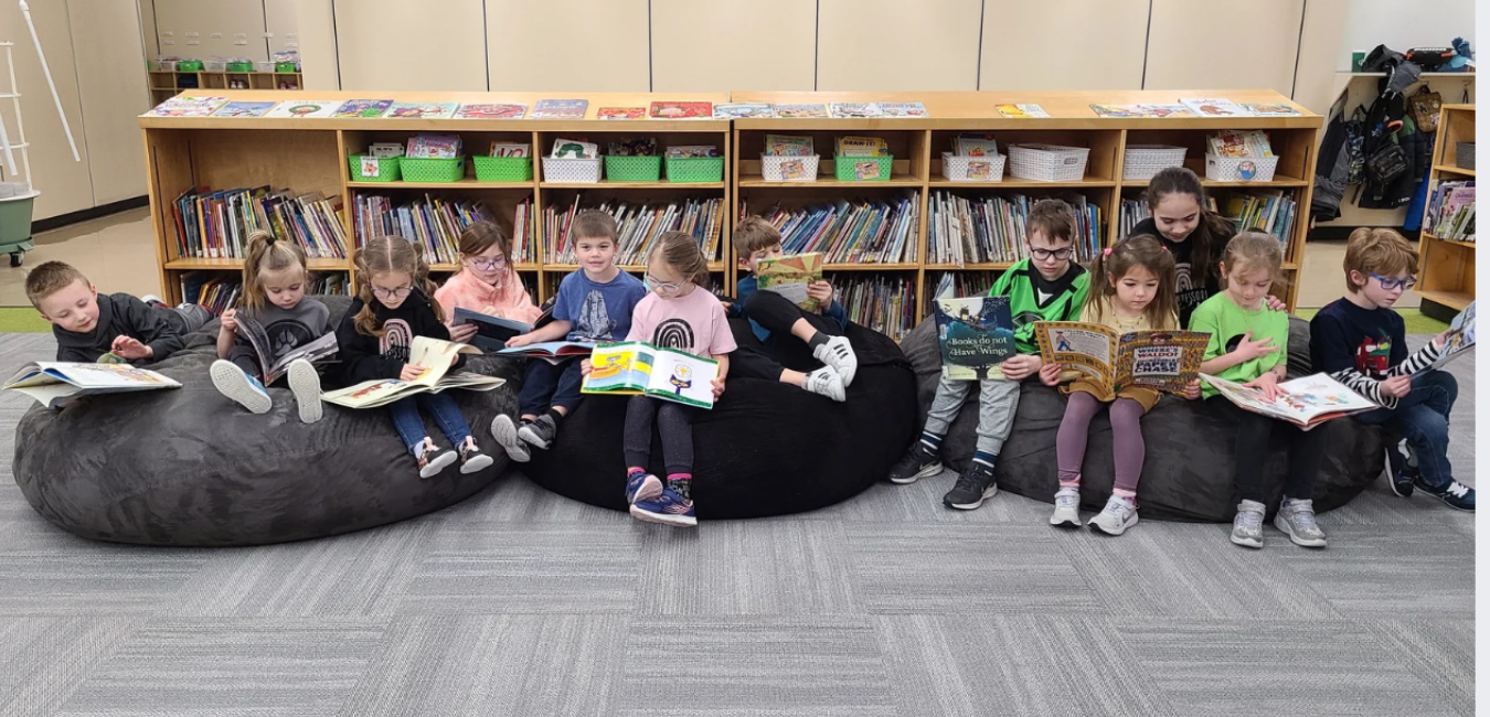 Children reading together in Library